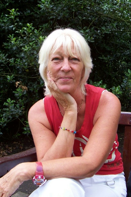 Susan May seated outdoors
